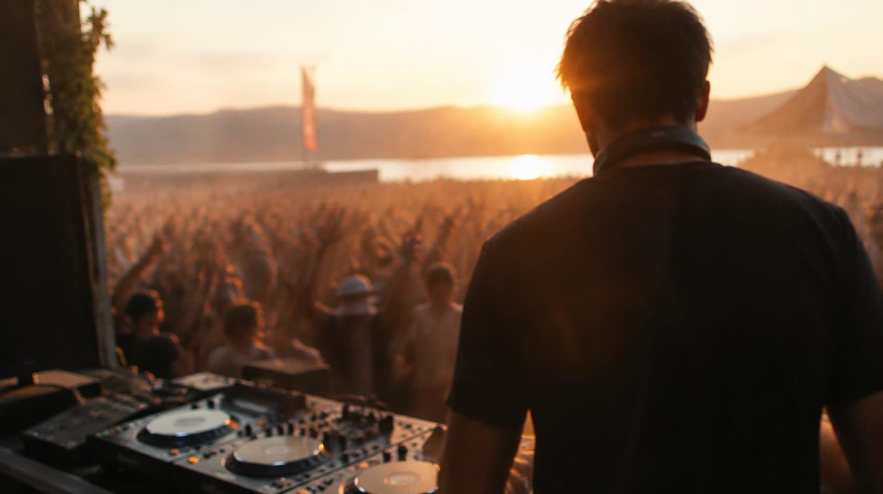 Festival stage at dusk from the DJ booth